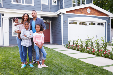 Family in front of house